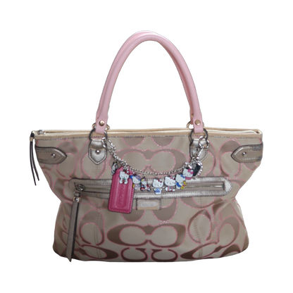 Handbag with decorative charms on a white background