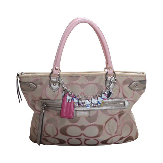 Handbag with decorative charms on a white background